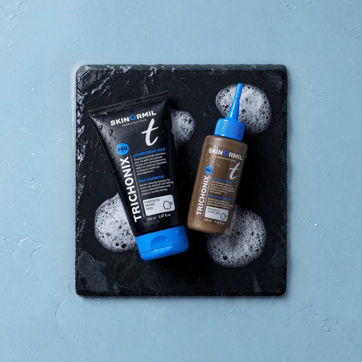 Skinormil Trichonix PSO shampoo and PSO concentrate on wet slate with foam
