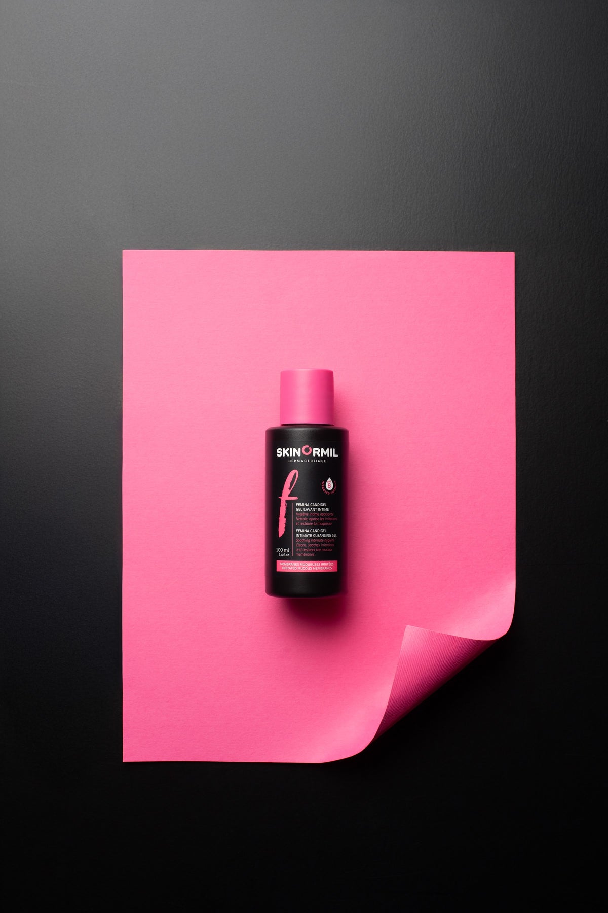 Femina Candigel on pink paper