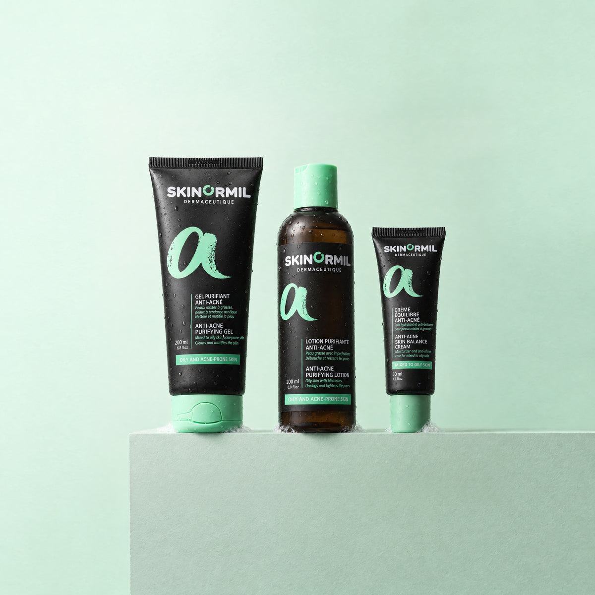 Skinormil Anti-Acne Essentials 3-step routine on a soft backdrop