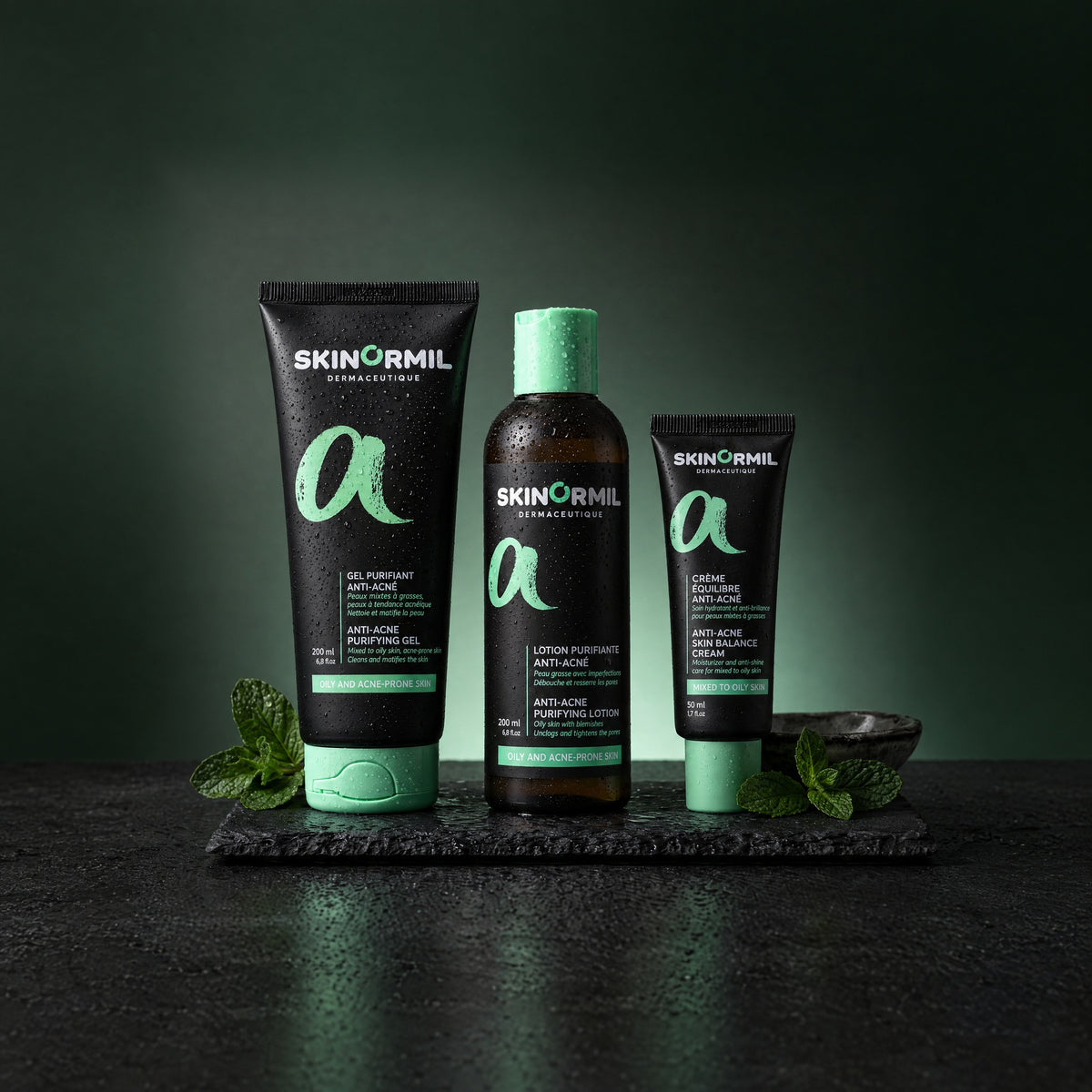 Skinormil Anti-Acne Essentials: purifying gel, purifying lotion and skin balance cream on wet slate